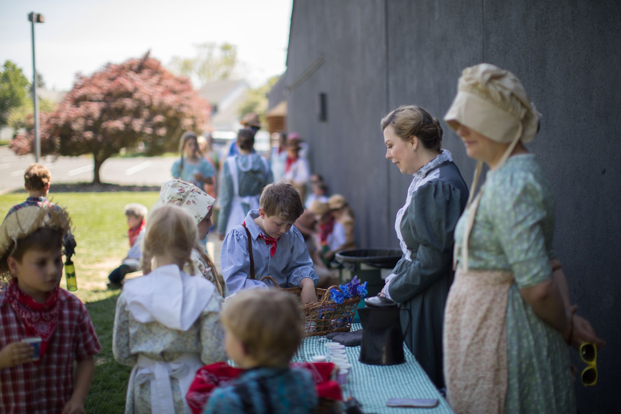 students and teachers in colonial dress