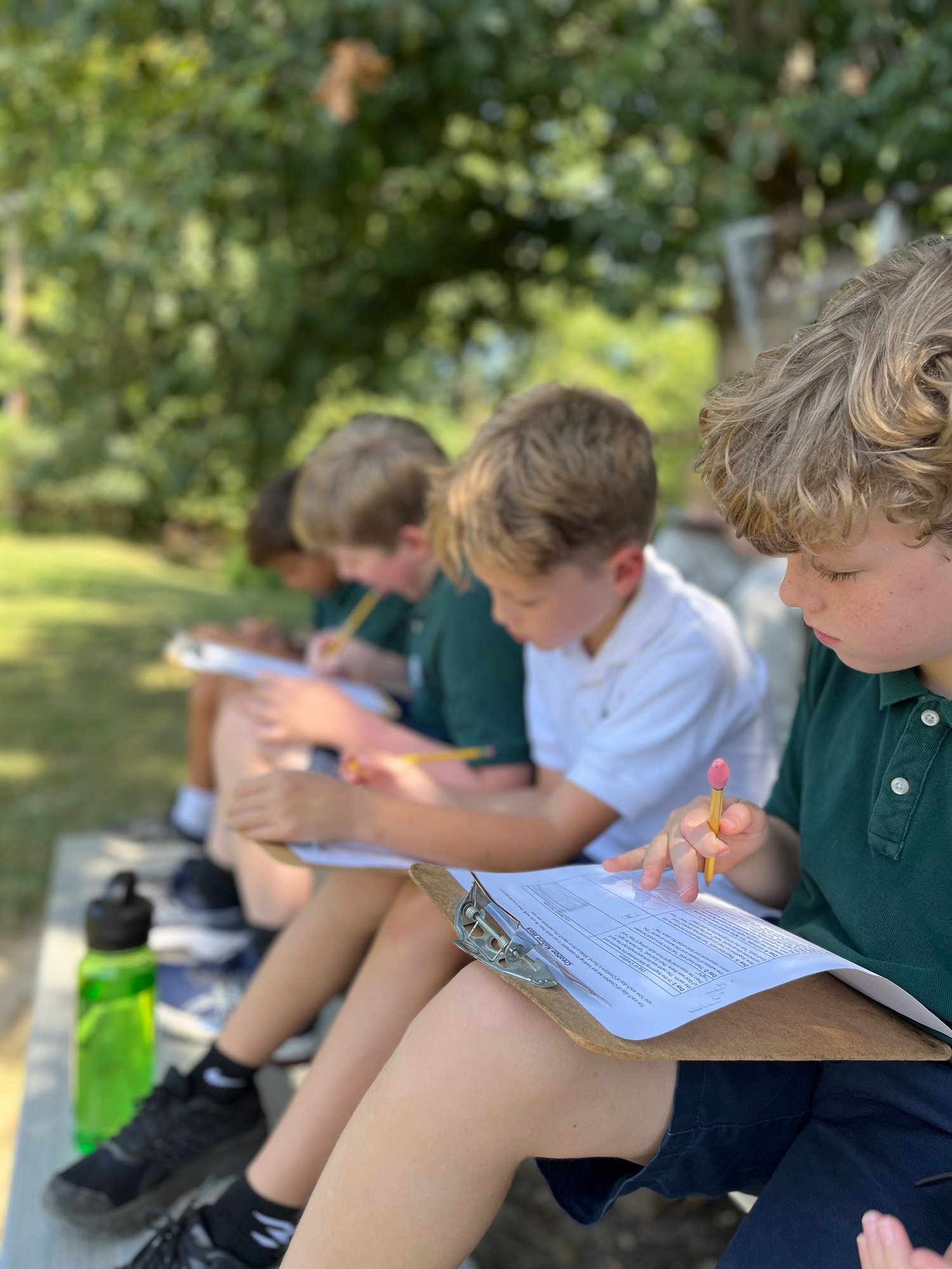 students outside with school work