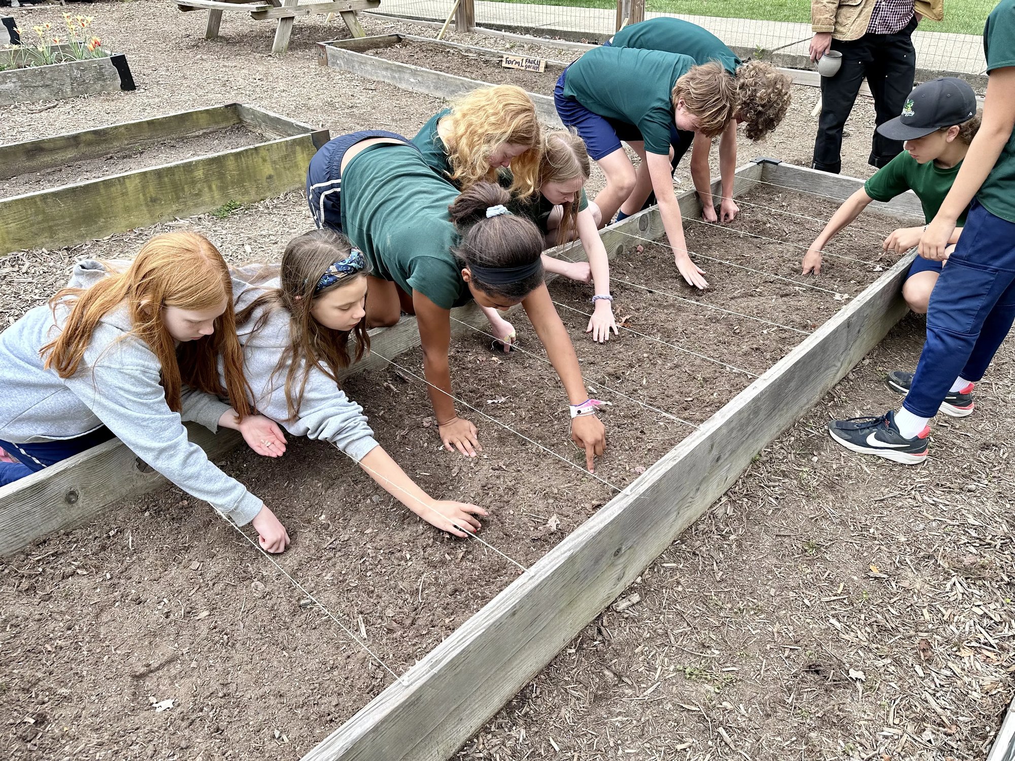 students planting seeds