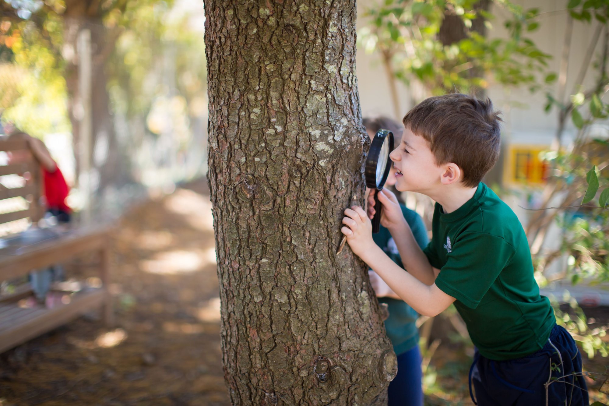 Student outside magnifying glass 